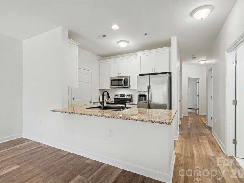 104 Pier 33 Drive, Mooresville, NC 28117.  MLS# CAR4378034, YatesRealty ID 11800. Kitchen has new cabinets/hardware, new granite, new sink and a new microwave!!