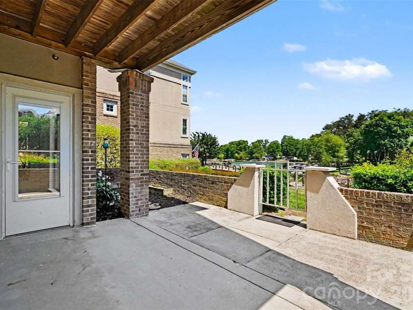104 Pier 33 Drive, Mooresville, NC 28117.  MLS# CAR4378034, YatesRealty ID 11800. View from your back patio. Even room for a flower garden or vegetable garden! Walk out your back door to the community boardwalk and view of the lovely Lake Norman!
