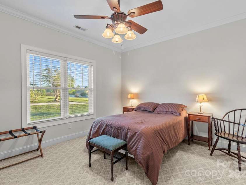 557 Luther Drive, Iron Station, NC 28080.  MLS# CAR4246000, YatesRealty ID 11801. Bedroom 2 enjoys peaceful views
