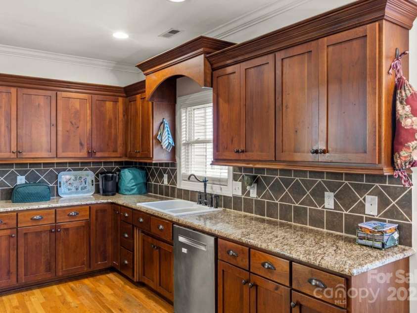 557 Luther Drive, Iron Station, NC 28080.  MLS# CAR4246000, YatesRealty ID 11801. Crown molding top the cabinets and ceiling