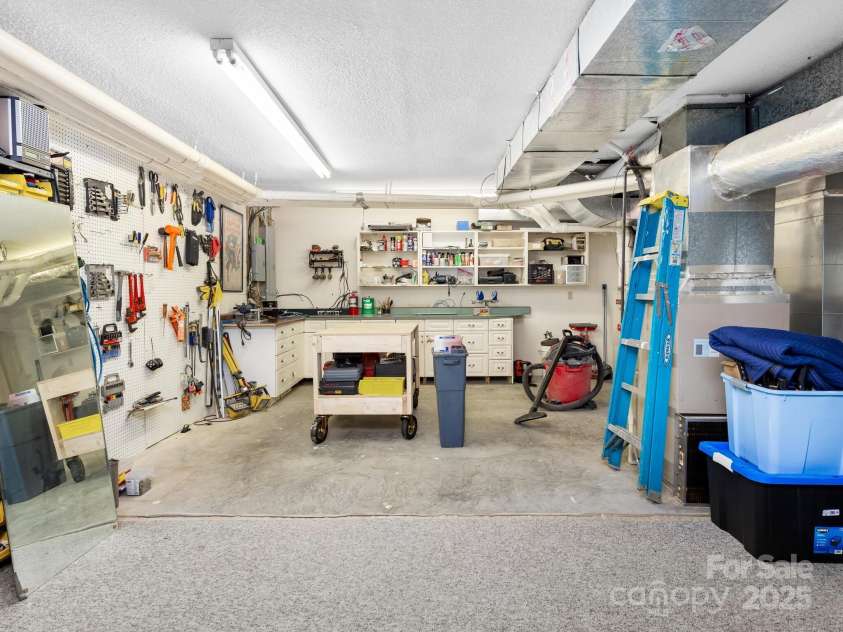 170 Weston Road, Arden, NC 28704.  MLS# CAR4222596, YatesRealty ID 11805. Over 950 sq ft of tinkering space in the basement shop