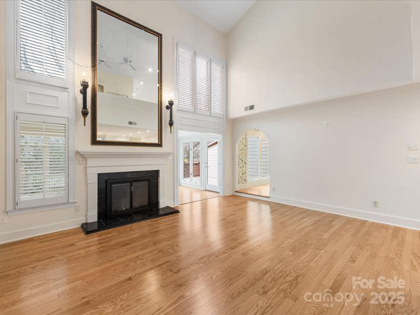 2027 Meadowood Lane, Charlotte, NC 28211.  MLS# CAR4224045, YatesRealty ID 11807. 2 Story Great Room with Wood Floors and Plantation Shutters.