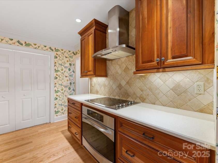 2027 Meadowood Lane, Charlotte, NC 28211.  MLS# CAR4224045, YatesRealty ID 11807. Custom Wood Cabinets with plenty of storage areas.