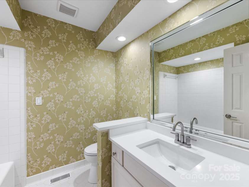 2027 Meadowood Lane, Charlotte, NC 28211.  MLS# CAR4224045, YatesRealty ID 11807. Full Bath #2 with Large Tile Garden Tub Shower, Tile Floor, New Solid Surface Counters