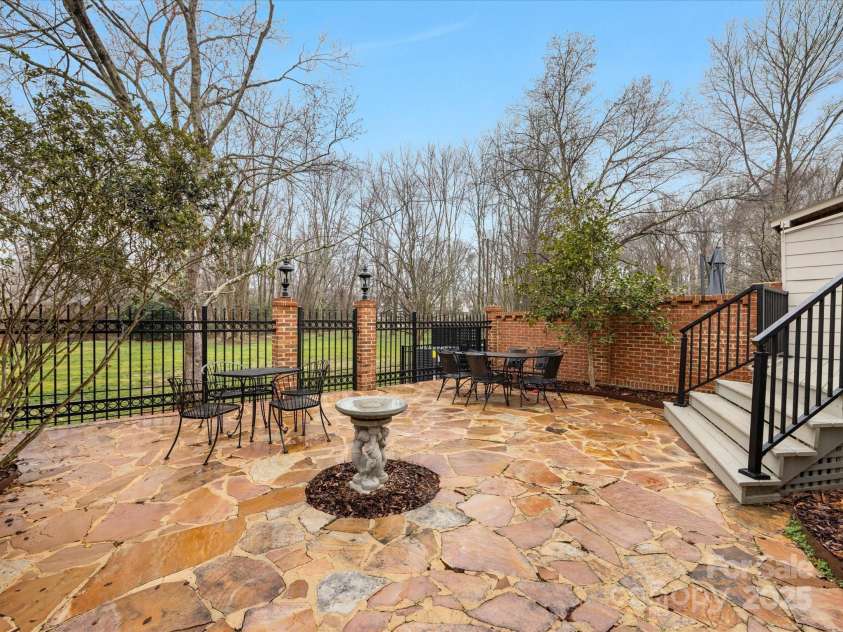 2027 Meadowood Lane, Charlotte, NC 28211.  MLS# CAR4224045, YatesRealty ID 11807. Huge Stone Private Patio with fenced yard