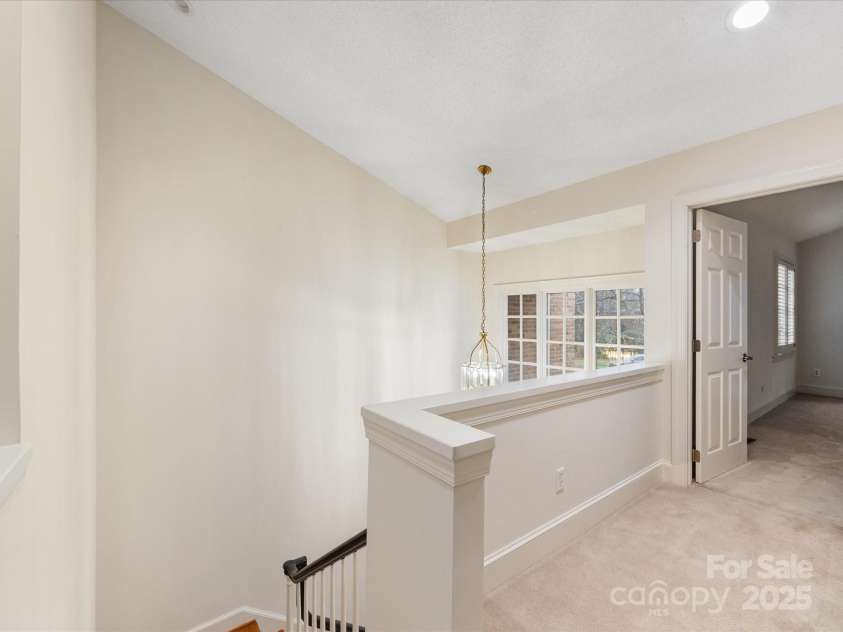 2027 Meadowood Lane, Charlotte, NC 28211.  MLS# CAR4224045, YatesRealty ID 11807. Landing at top of Staircase.