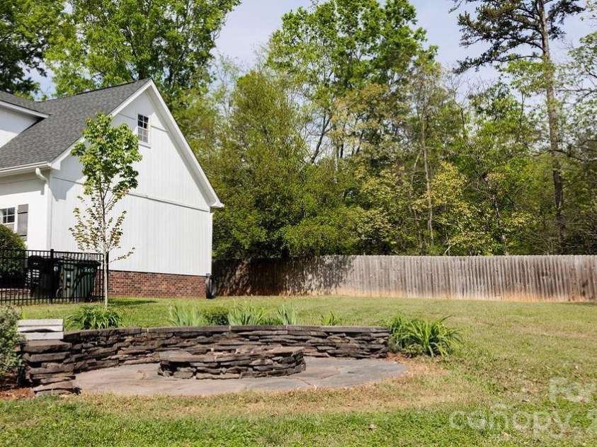 517 Sunnyside Drive, Concord, NC 28025.  MLS# CAR4367773, YatesRealty ID 11808. Firepit
