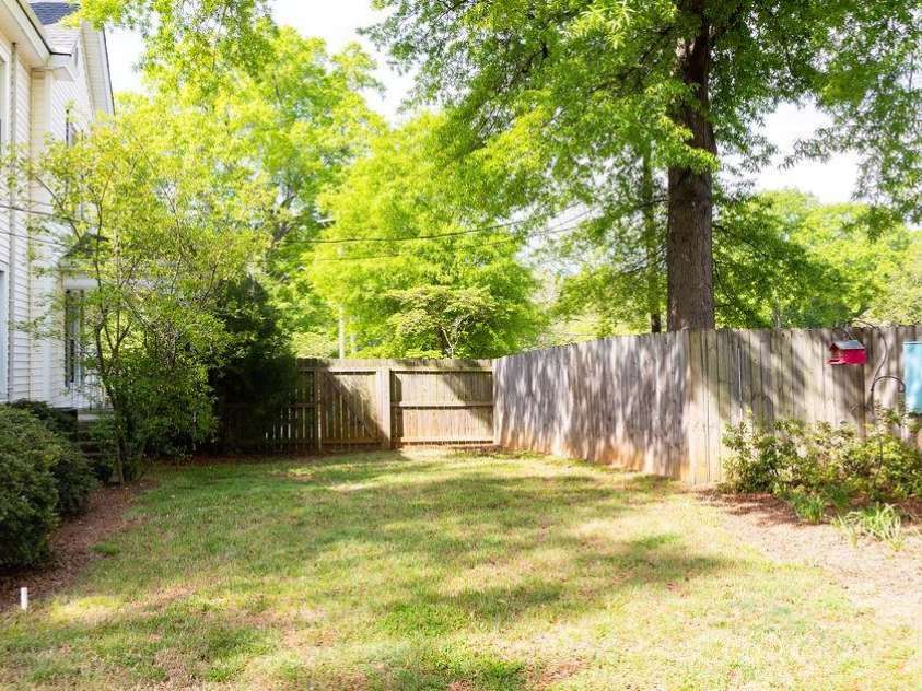 517 Sunnyside Drive, Concord, NC 28025.  MLS# CAR4367773, YatesRealty ID 11808. Side yard