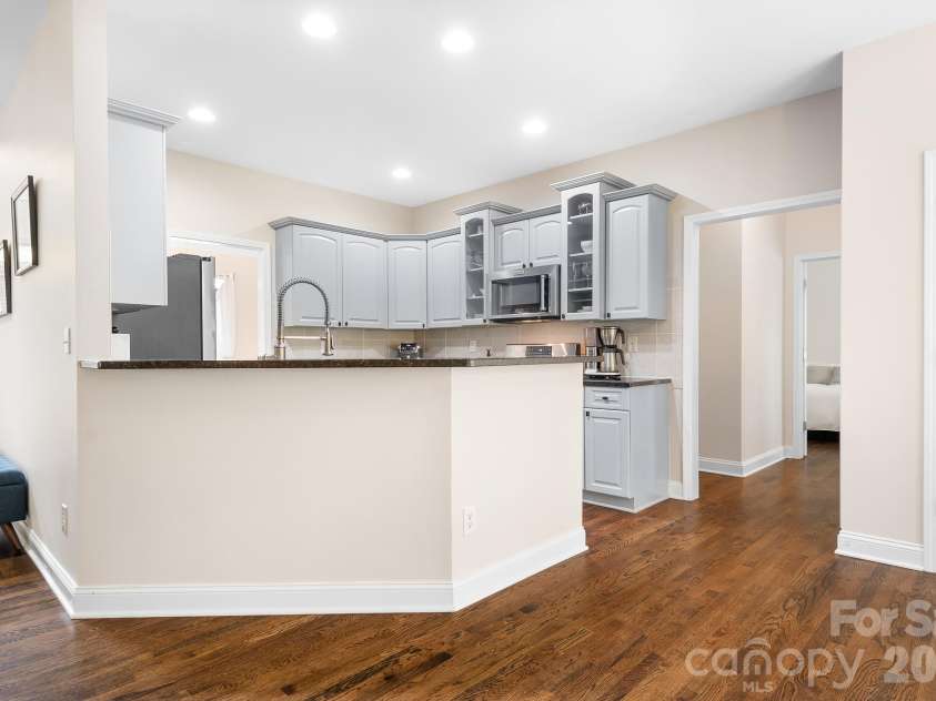 5617 Sugarcane Court, Mint Hill, NC 28227.  MLS# CAR4366997, YatesRealty ID 11809. Kitchen has a raised bar for extra seating