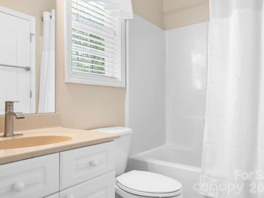 5617 Sugarcane Court, Mint Hill, NC 28227.  MLS# CAR4366997, YatesRealty ID 11809. Main level full bathroom
