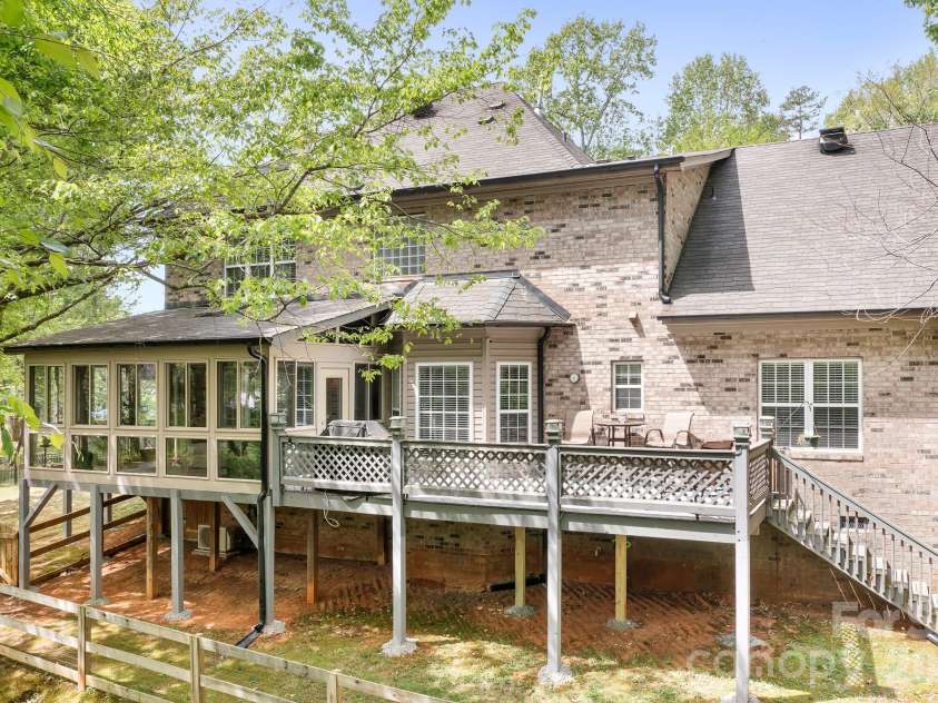 5617 Sugarcane Court, Mint Hill, NC 28227.  MLS# CAR4366997, YatesRealty ID 11809. Sunroom and deck