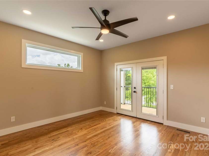 1715 Old Haywood Road, Asheville, NC 28806.  MLS# CAR4292404, YatesRealty ID 11812. Primary ensuite bedroom