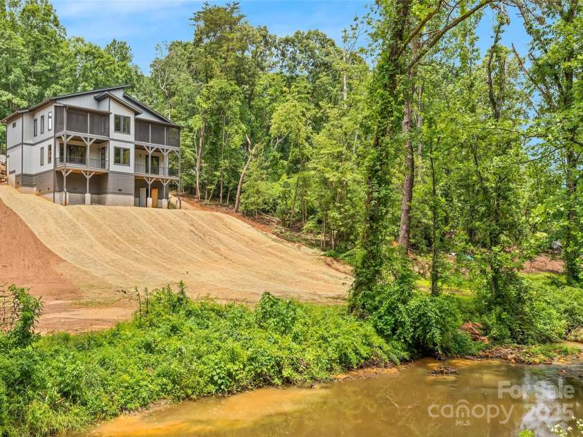 27 George Allen Ridge, Arden, NC 28704.  MLS# CAR4241501, YatesRealty ID 11818. Rear Elevation with Gorgeous Creekside Lot