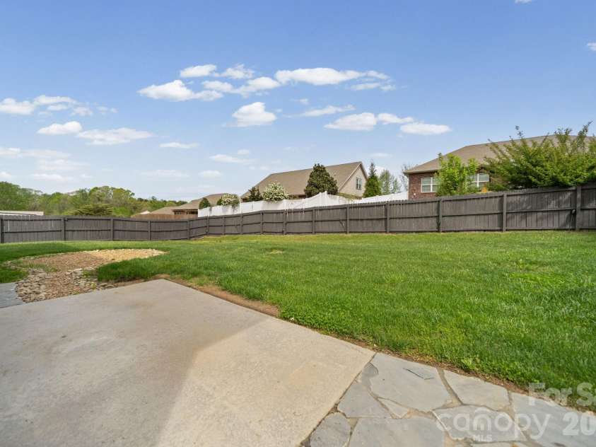 7219 Ogden Place, Denver, NC 28037.  MLS# CAR4367719, YatesRealty ID 11821. Back yard, fenced in with patio