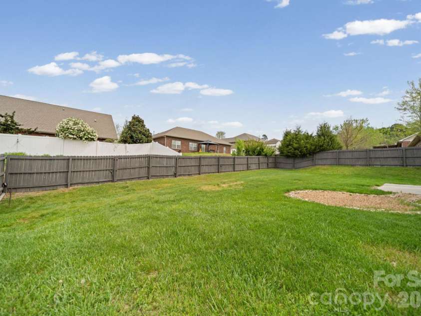 7219 Ogden Place, Denver, NC 28037.  MLS# CAR4367719, YatesRealty ID 11821. Back yard, fenced in with patio