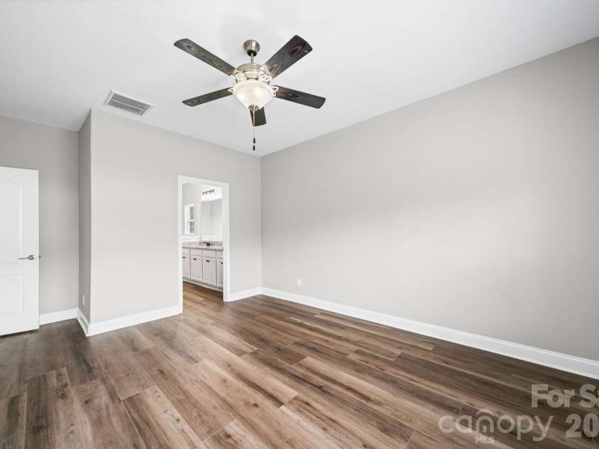 7219 Ogden Place, Denver, NC 28037.  MLS# CAR4367719, YatesRealty ID 11821. Master bedroom, main level