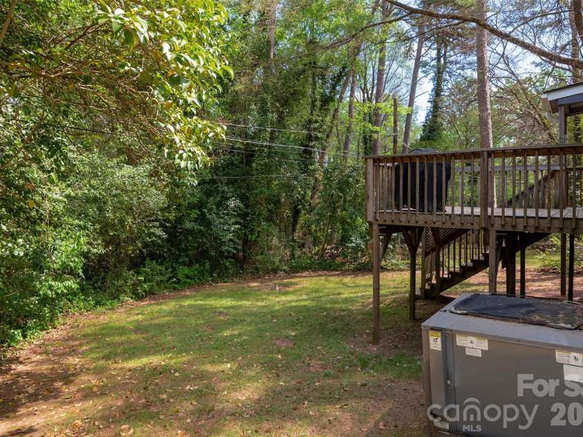 2516 Columbus Circle, Charlotte, NC 28208.  MLS# CAR4341027, YatesRealty ID 11822. Private yard extends down to the stream!