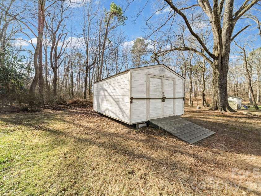 3616 Haigler Road, Monroe, NC 28110.  MLS# CAR4336855, YatesRealty ID 1184. Storage Building at back of lot