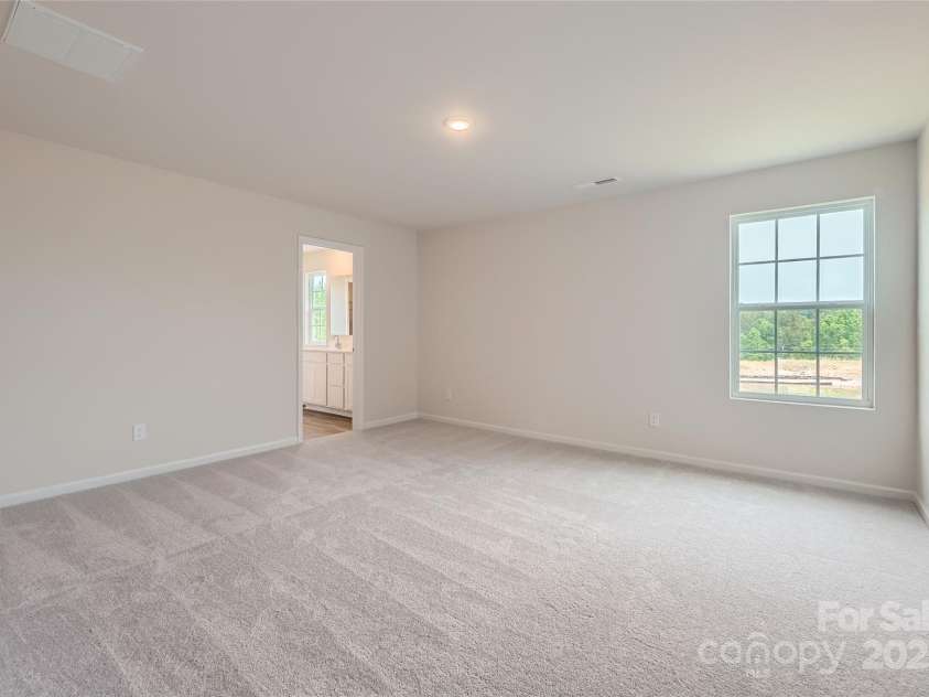 155 Astor Street, Troutman, NC 28166.  MLS# CAR4252687, YatesRealty ID 11842. Primary Bedroom