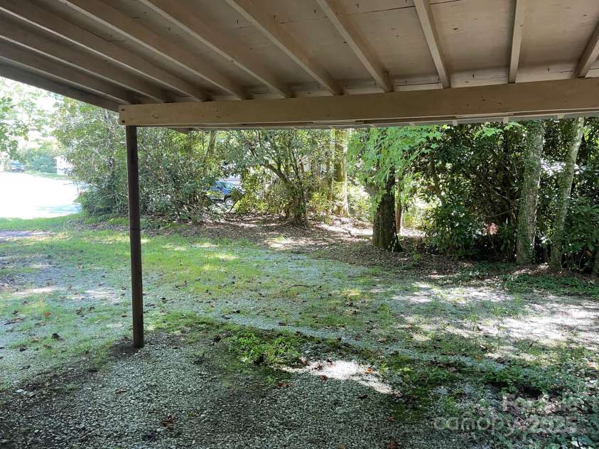 142 Whitewater Road, Sapphire, NC 28774.  MLS# CAR4229231, YatesRealty ID 1185. Carport second home 
