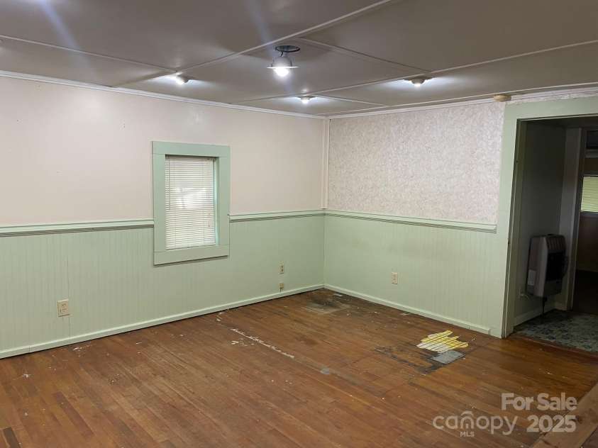 142 Whitewater Road, Sapphire, NC 28774.  MLS# CAR4229231, YatesRealty ID 1185. Living room of small home 