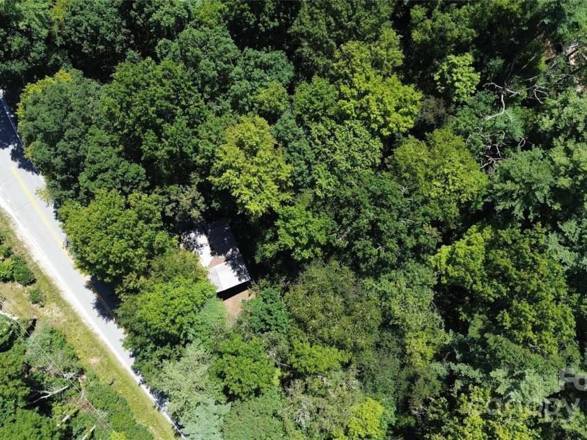 142 Whitewater Road, Sapphire, NC 28774.  MLS# CAR4229231, YatesRealty ID 1185. Road Frontage small house in photo 