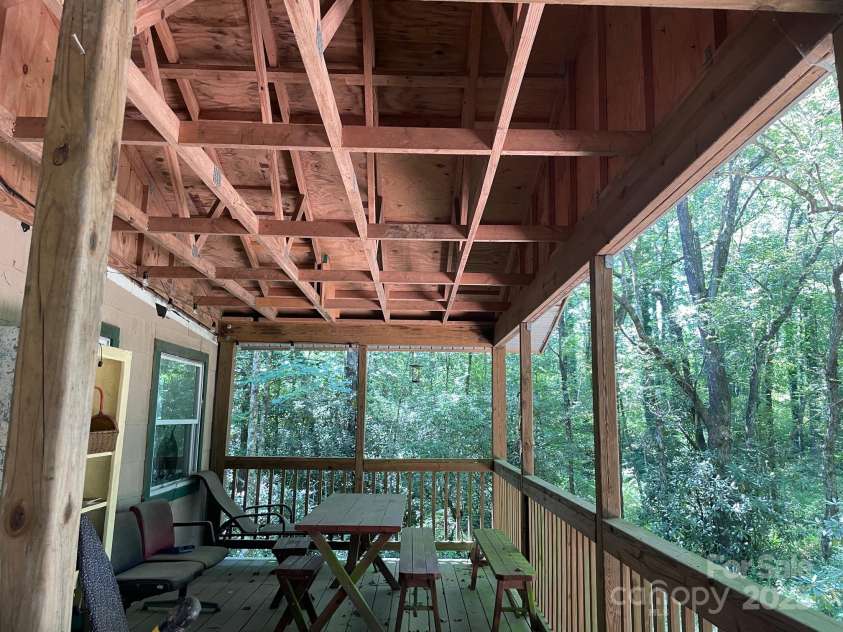 142 Whitewater Road, Sapphire, NC 28774.  MLS# CAR4229231, YatesRealty ID 1185. Second home front porch 