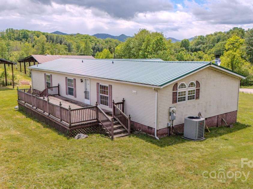22 Hominy Baptist Church Road, Candler, NC 28715.  MLS# CAR4255118, YatesRealty ID 11853. Back deck