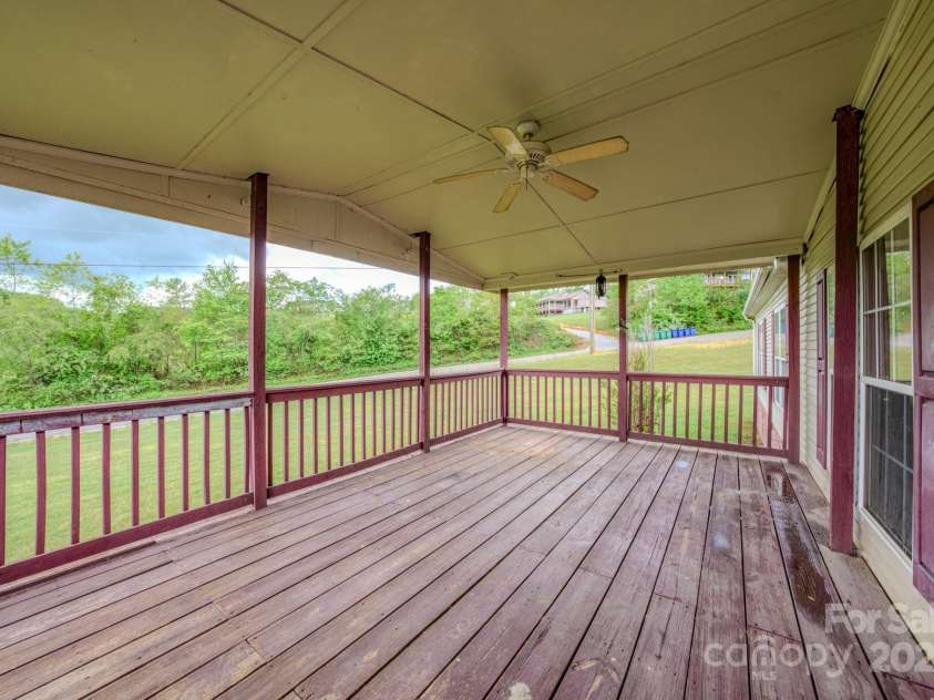 22 Hominy Baptist Church Road, Candler, NC 28715.  MLS# CAR4255118, YatesRealty ID 11853. Front covered deck