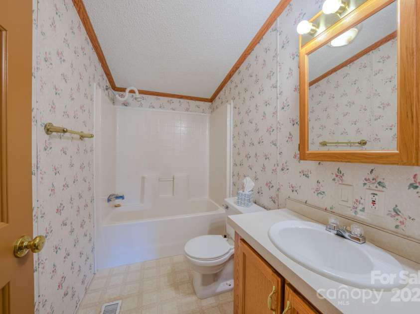 22 Hominy Baptist Church Road, Candler, NC 28715.  MLS# CAR4255118, YatesRealty ID 11853. Guest bathroom