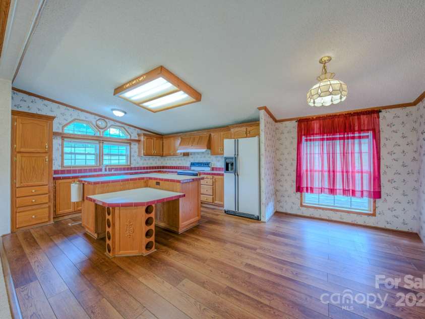 22 Hominy Baptist Church Road, Candler, NC 28715.  MLS# CAR4255118, YatesRealty ID 11853. New flooring in kitchen