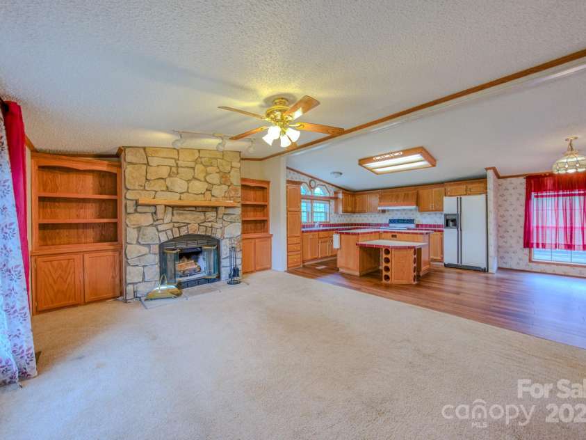 22 Hominy Baptist Church Road, Candler, NC 28715.  MLS# CAR4255118, YatesRealty ID 11853. Open floor plan between family room and kitchen