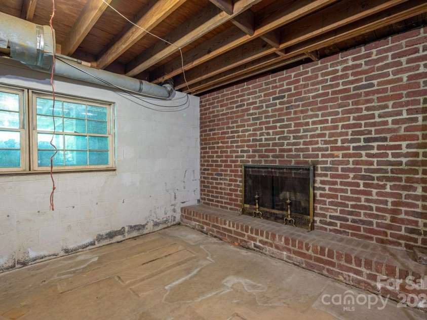 104 Ridge Drive, Stanley, NC 28164.  MLS# CAR4255622, YatesRealty ID 11856. Basement Fireplace
