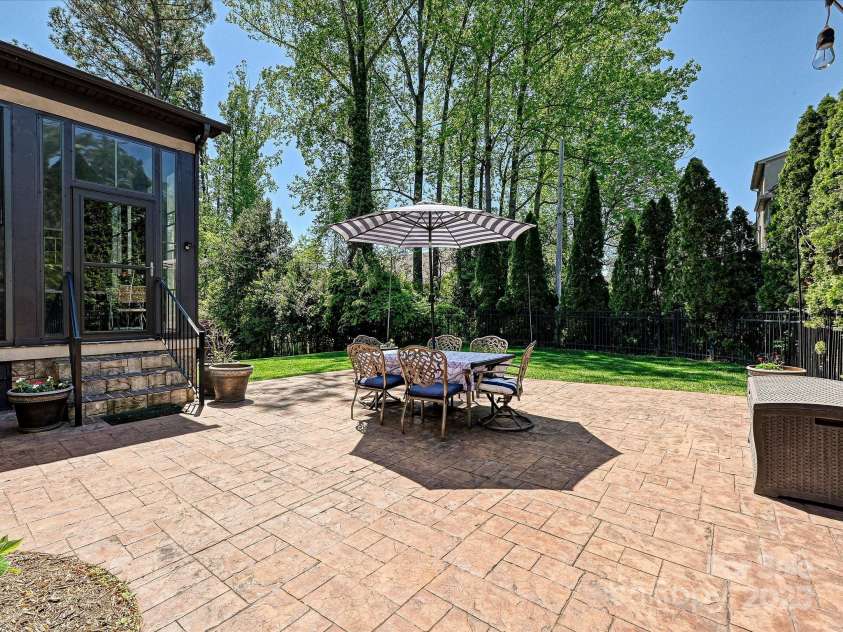 7208 Ashton Gate Drive, Charlotte, NC 28270.  MLS# CAR4246085, YatesRealty ID 11858. Al fresco dining/entertaining area with view to backyard