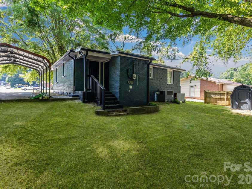 3637 Glenville Avenue, Charlotte, NC 28215.  MLS# CAR4382722, YatesRealty ID 11859. Back of home angled left. Carport on the left.