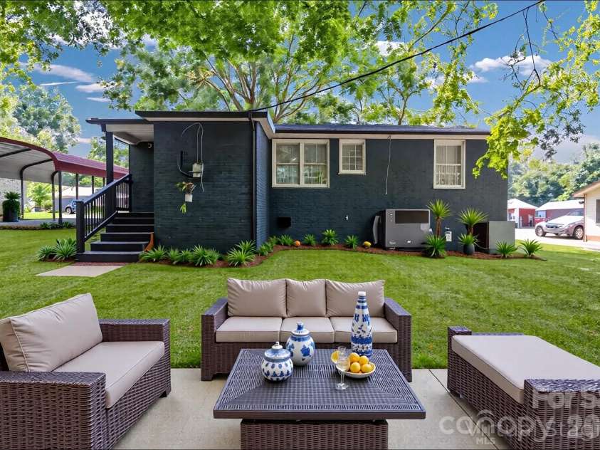 3637 Glenville Avenue, Charlotte, NC 28215.  MLS# CAR4382722, YatesRealty ID 11859. Central shot of back of home (virtually staged).