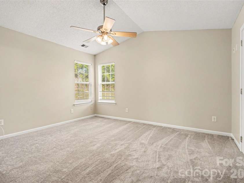 117 Tanninger Road, Mount Holly, NC 28120.  MLS# CAR4369673, YatesRealty ID 11868. Vaulted Ceiling in Primary Bedroom