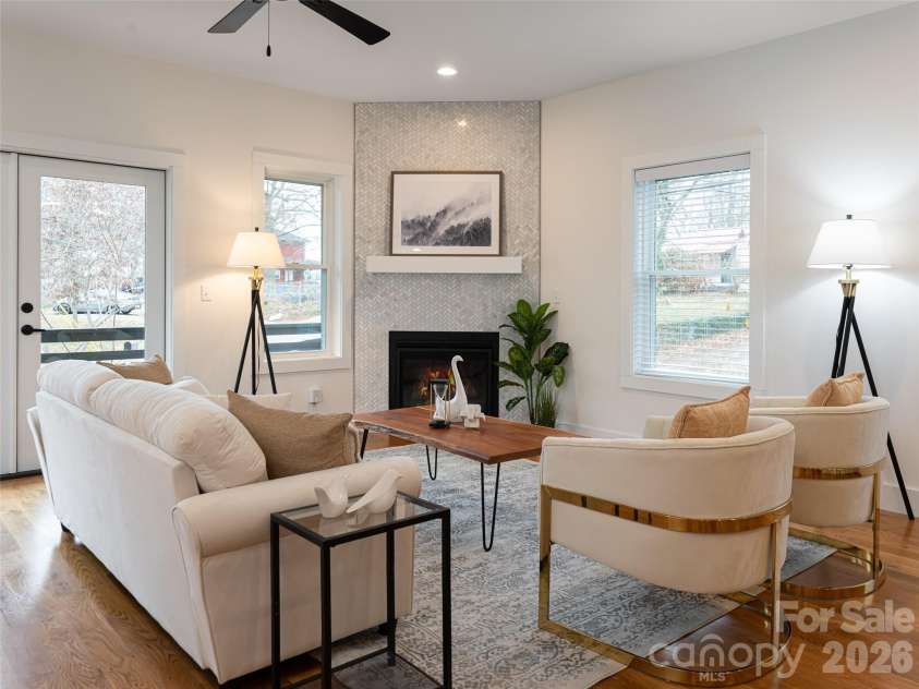 197 Chatham Road, Asheville, NC 28804.  MLS# CAR4290361, YatesRealty ID 11880. Large open Great Room filled with natural light, fireplace and beautiful wood floors
