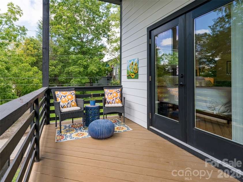 197 Chatham Road, Asheville, NC 28804.  MLS# CAR4290361, YatesRealty ID 11880. Primary Bedroom Deck on upper level. Spacious and inviting