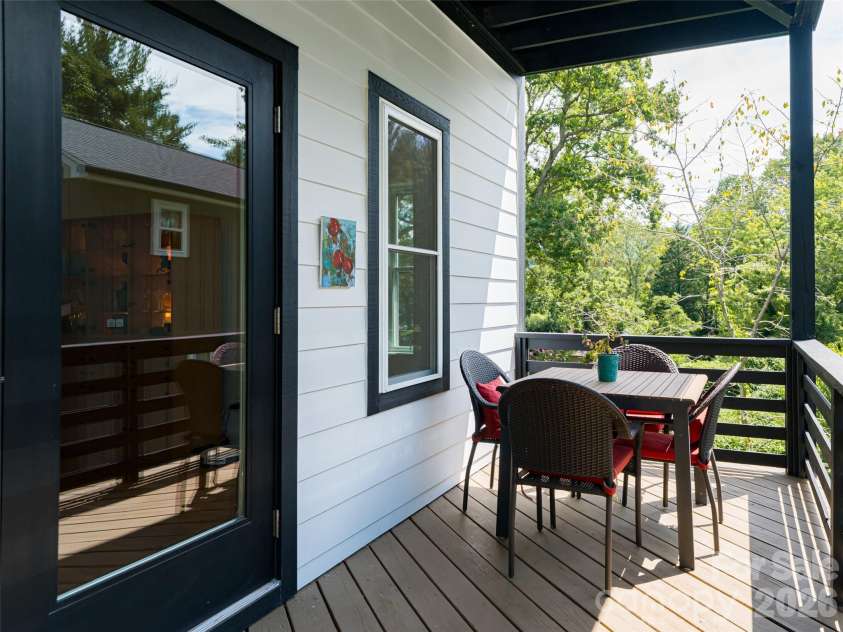 197 Chatham Road, Asheville, NC 28804.  MLS# CAR4290361, YatesRealty ID 11880. Upper level deck dining area with access from Great Room