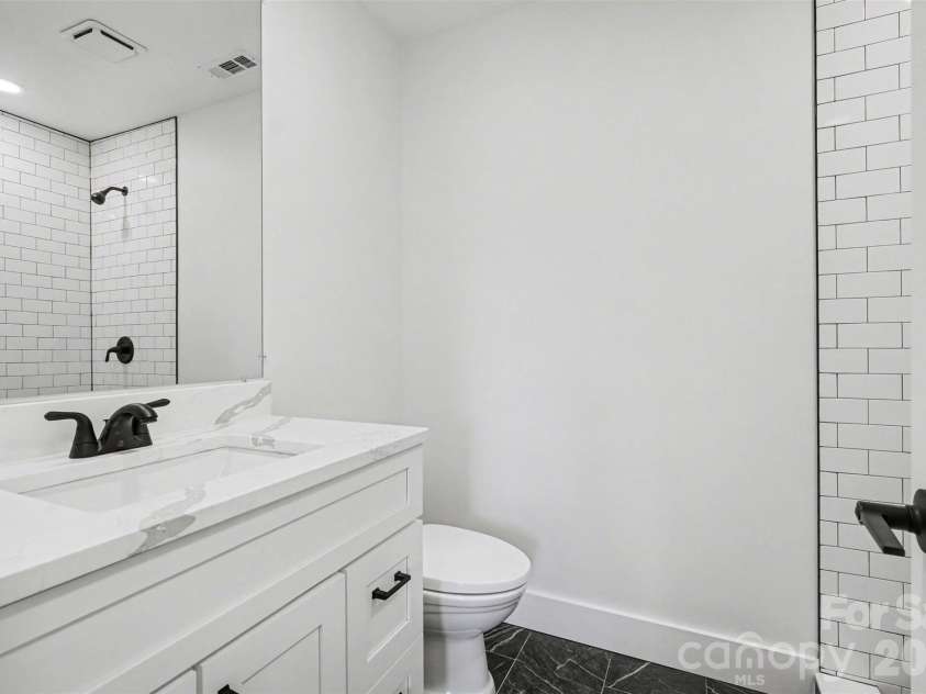 10237 Cairnsmore Place, Mint Hill, NC 28227.  MLS# CAR4363397, YatesRealty ID 11883. Hall bathroom with tiled shower