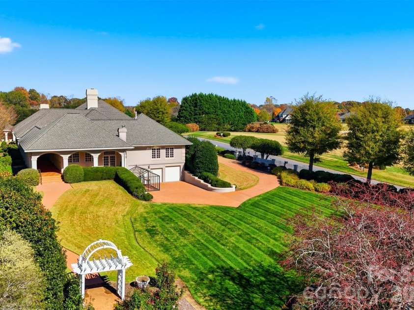 3619 Links Drive, Conover, NC 28613.  MLS# CAR4315421, YatesRealty ID 11899. Aerial side view highlighting golf course frontage, privacy, and beautifully landscaped grounds.