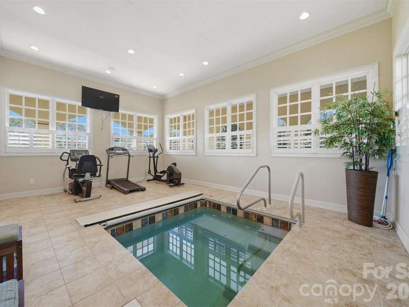 3619 Links Drive, Conover, NC 28613.  MLS# CAR4315421, YatesRealty ID 11899. Exercise room featuring a built-in hot tub for ultimate relaxation and wellness.