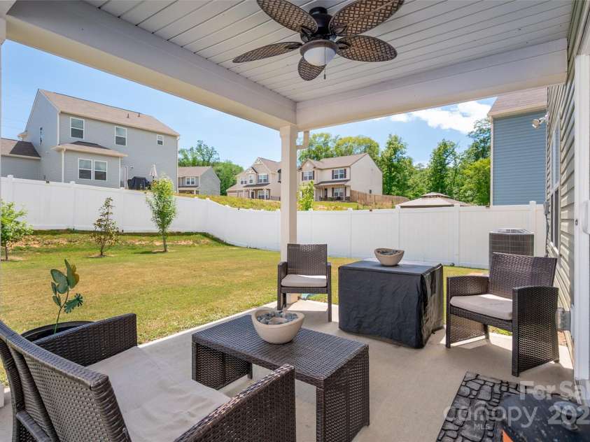 507 Newfound Hollow Drive, Charlotte, NC 28214.  MLS# CAR4252312, YatesRealty ID 11899. Covered patio overlooking large year yard