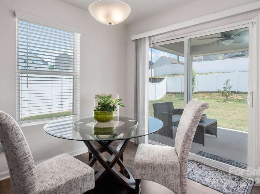 507 Newfound Hollow Drive, Charlotte, NC 28214.  MLS# CAR4252312, YatesRealty ID 11899. Dining area has direct access to covered patio