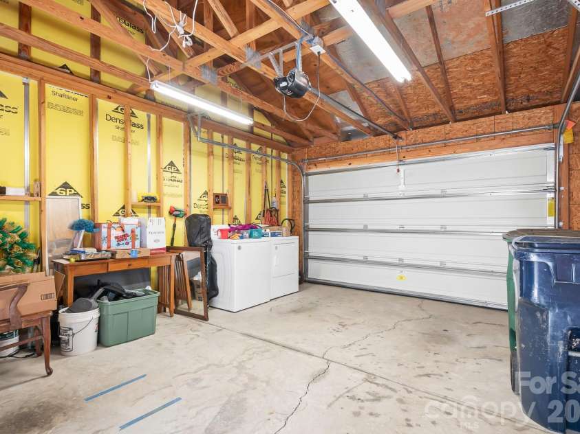 18478 Catawba Avenue, Cornelius, NC 28031.  MLS# CAR4322308, YatesRealty ID 11900. Inside garage