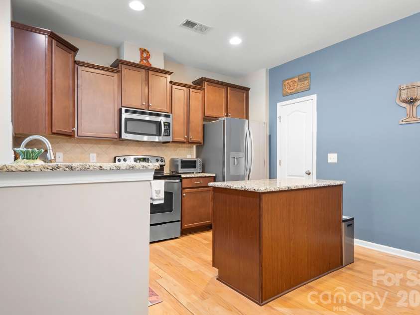 18478 Catawba Avenue, Cornelius, NC 28031.  MLS# CAR4322308, YatesRealty ID 11900. Kitchen features a walk in pantry