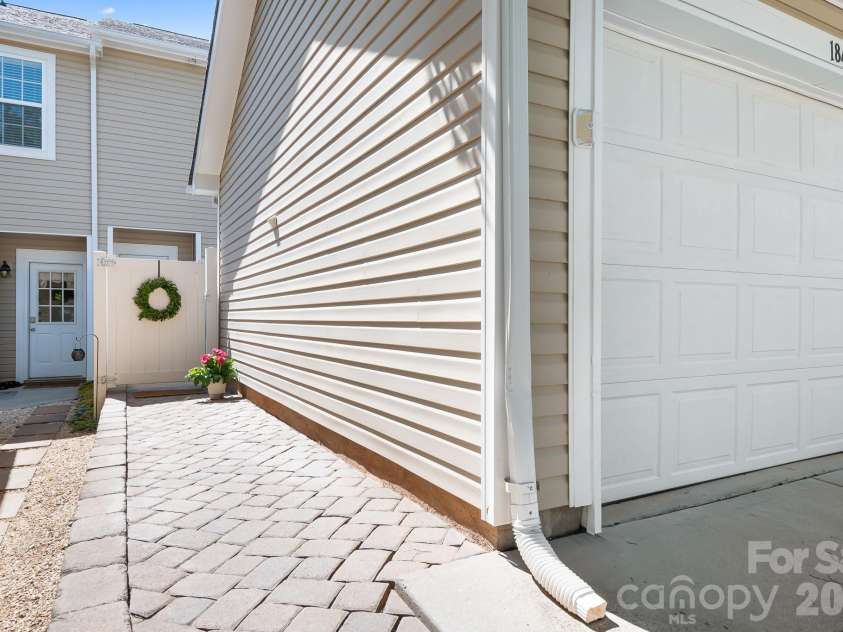 18478 Catawba Avenue, Cornelius, NC 28031.  MLS# CAR4322308, YatesRealty ID 11900. PVC fencing gated entry