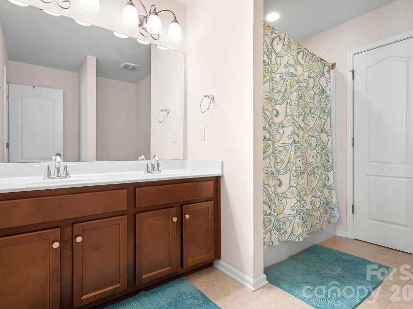 18478 Catawba Avenue, Cornelius, NC 28031.  MLS# CAR4322308, YatesRealty ID 11900. Shared oversized bathroom