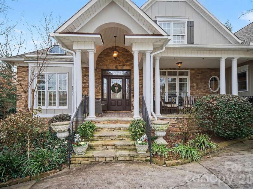 6722 Fox Ridge Circle, Davidson, NC 28036.  MLS# CAR4334663, YatesRealty ID 11905. Large front porch welcomes you home. 